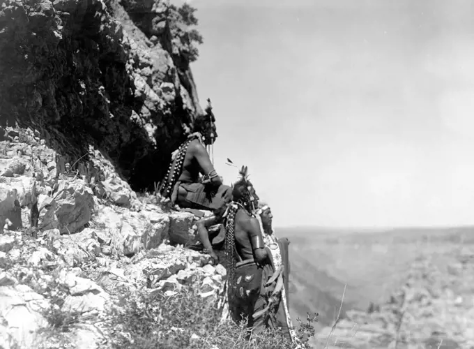 Edward S. Curtis Native American Indians - Native Americans looking out over the plains from the side of a cliff ca. 1905. 