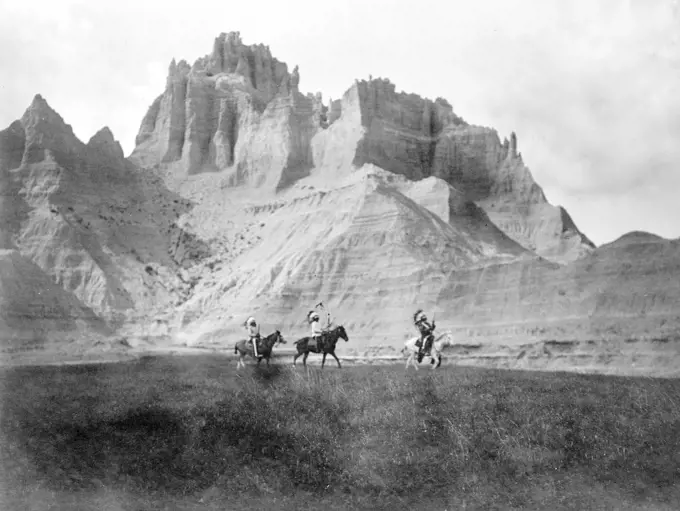 Edward S. Curtis Native American Indians - Entering the Bad Lands. Three Sioux Indians on horseback ca. 1905. 