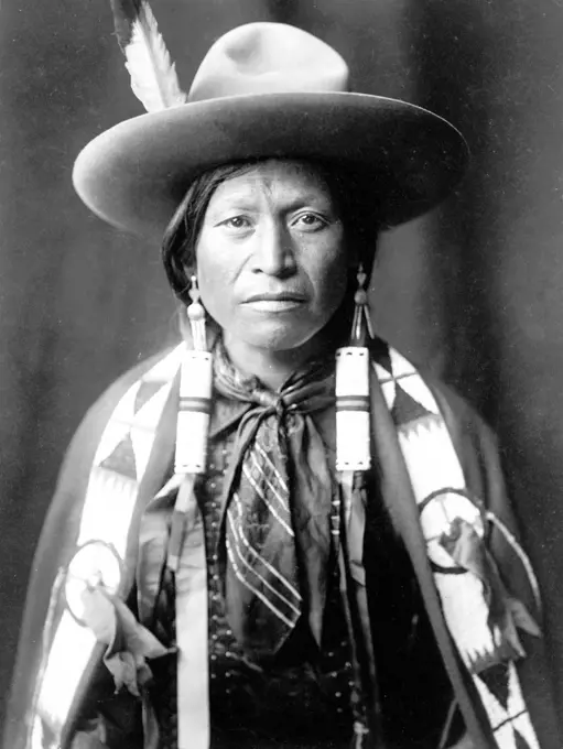Edward S. Curtis Native American Indians - Jicarilla Apache Indian wearing Cowboy hat ca. 1905. 