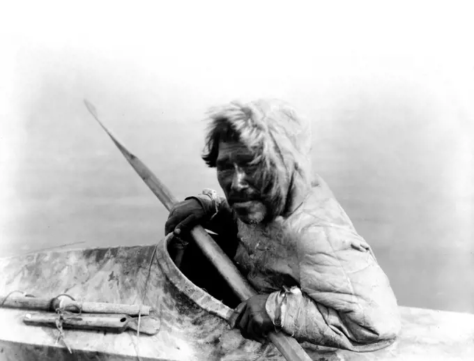 Edward S. Curtis Native American Indians - The seal-hunter, Noatak, in kayak, facing left ca. 1929. 