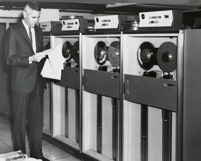 Edward Stone in front of an IBM Computer Tape Bank July 1967. 
