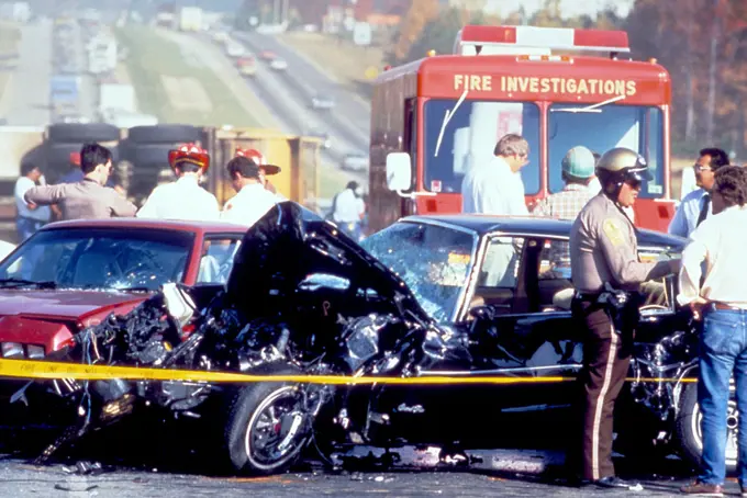 This photograph, captured in metropolitan Atlanta, Georgia, depicts what had been a severe motor vehicle collision. At this point, Atlanta police, paramedics, and the Fire Investigation Team, were all on the scene. The drivers conditions were not known, nor the details surrounding the cause of this accident. 