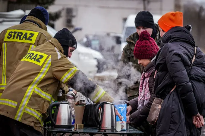 entry of refugees from Ukraine through the border check point in Medyka, volunteers offer food and hot drinks, welcome