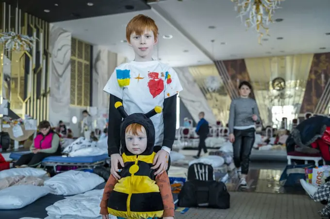 Ukranian refugees at a temporary shelter created inside the big ballroom and reception hall of the luxurious hotel Mandachi, in the Romanian town of Suceava, around 30 minutes from the border between Ukraine and Romania