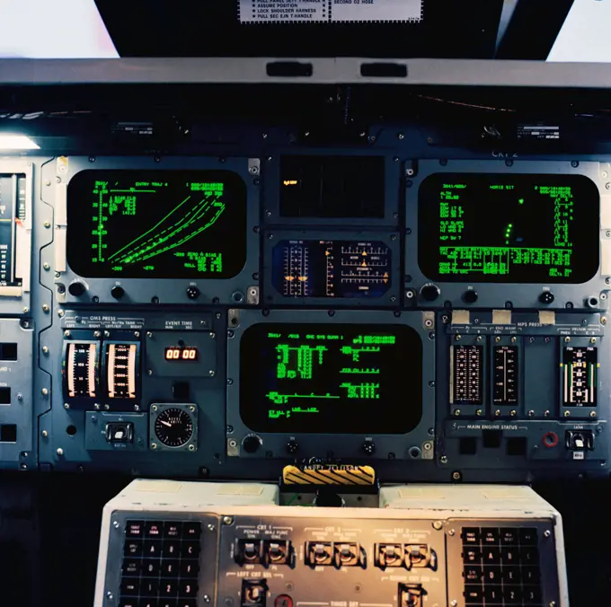 (15 March 1979) --- An interior view of the space shuttle mission simulator (SMS), featuring the area between the commander and pilot positions which houses displays and controls. The cathode ray tube (CRT) computer displays are at top; a portion of the computer keyboards for the commander and pilot can be seen at bottom center. This SMS motion base simulator is located in the mission simulation and training facility at NASA's Johnson Space Center (JSC).