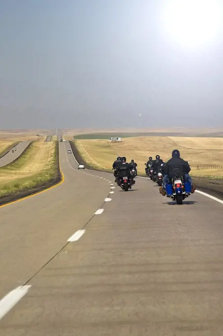 Traveling on the open road, Interstate 90 in South Dakota. Group of motorcyclist on the open road enjoying their freedom to travel.