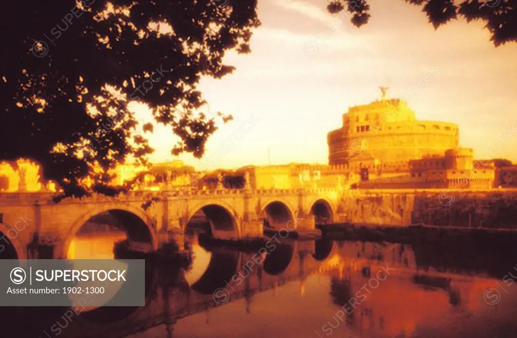 Italy Rome view of Castel Sant Angelo the Tiber River and Ponte Sant Angelo in warm grainy tones