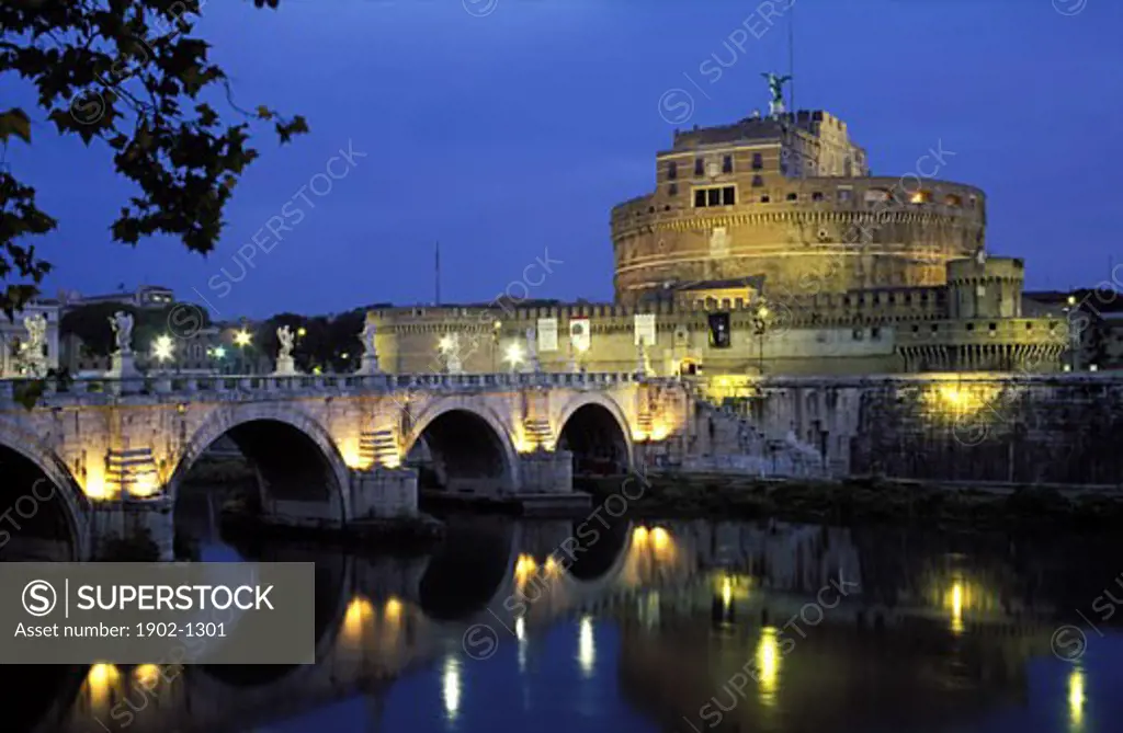 Italy Rome view of Castel Sant Angelo the Tiber River and Ponte Sant Angelo illuminated at dawn