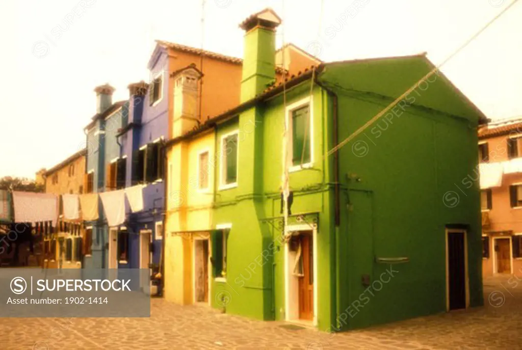 Italy Island of Burano colorful homes with laundry hanging