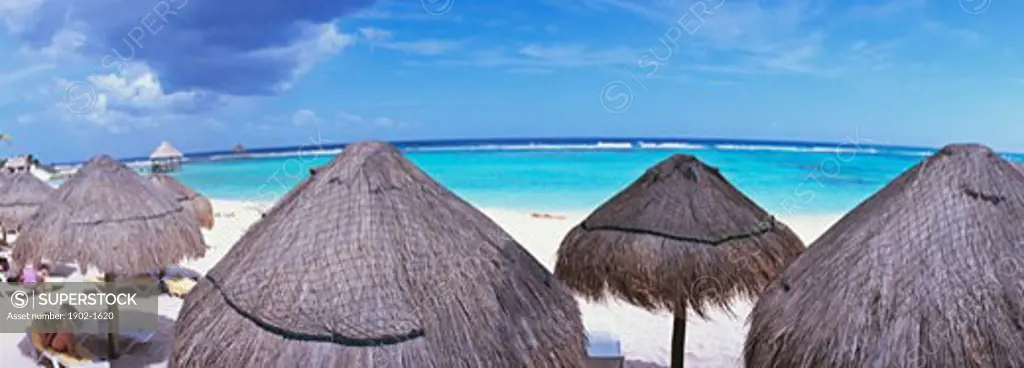 Mexico Quintana Roo Yucatan Peninsula Akumal Mayan Riviera panoramic view of beach and sea with palapas