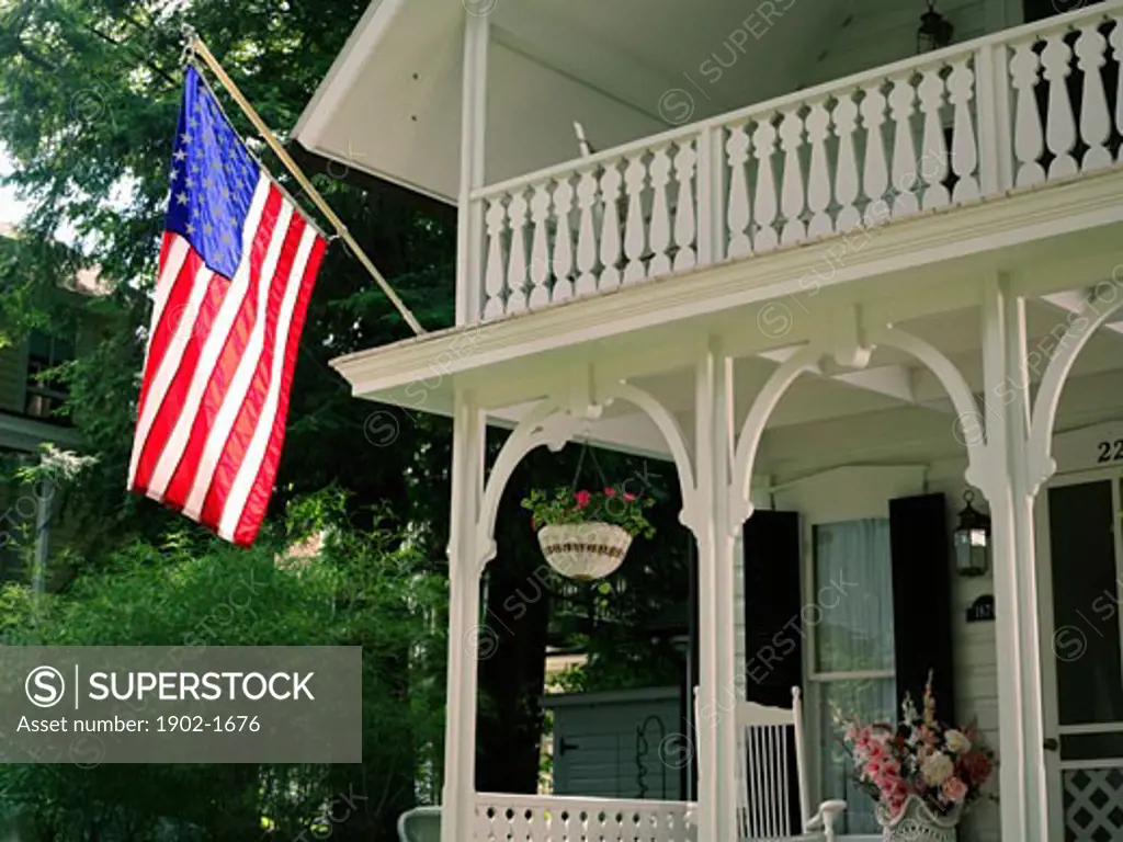 USA New York Chautauqua Victorian home displaying the American flag