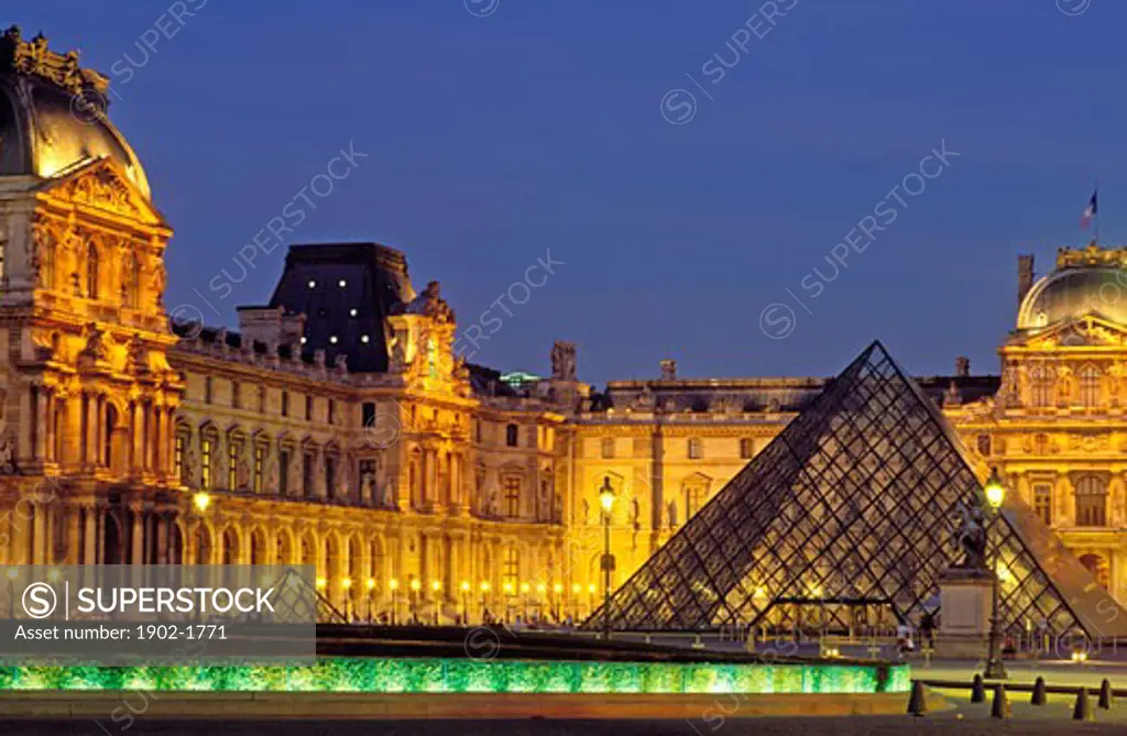 France Paris The Louvre with I M Peis pyramid illuminated at night