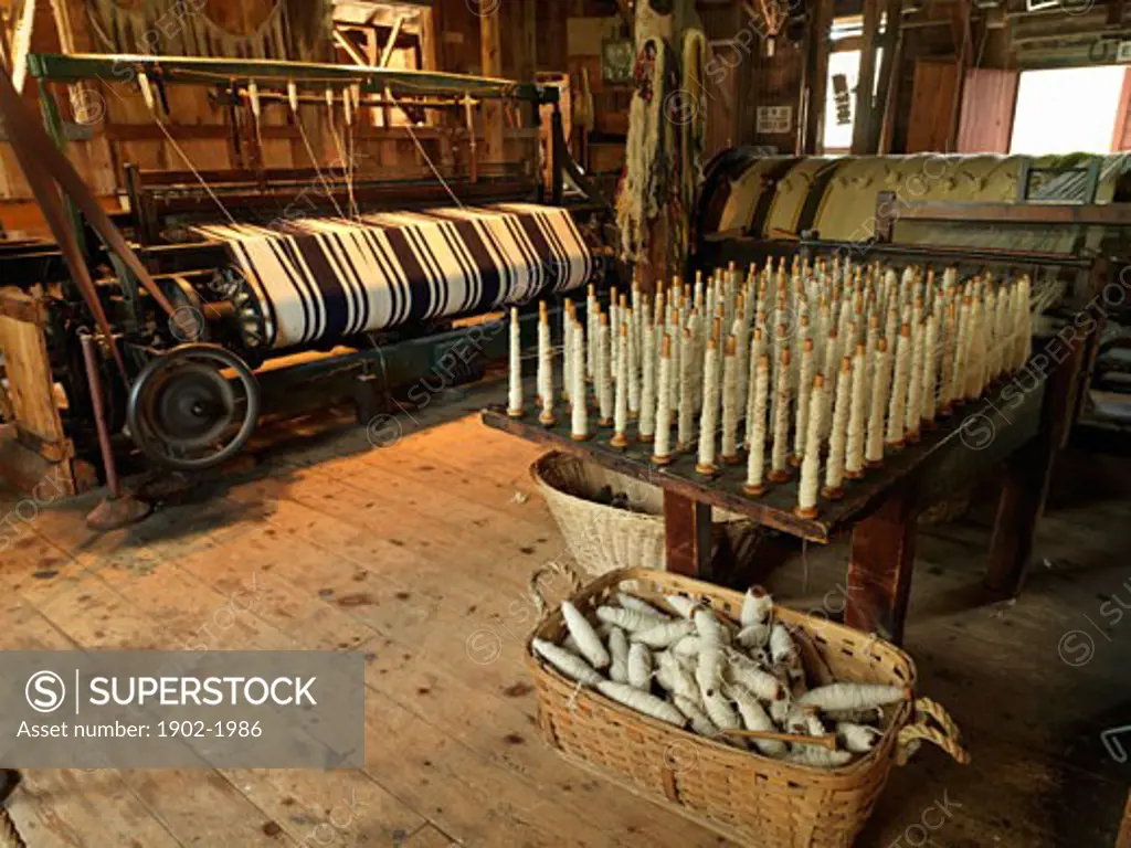 Canada Ontario Morrisburg Upper Canada Village recreation of pioneer life circa 1860s loom using spun sheep wool