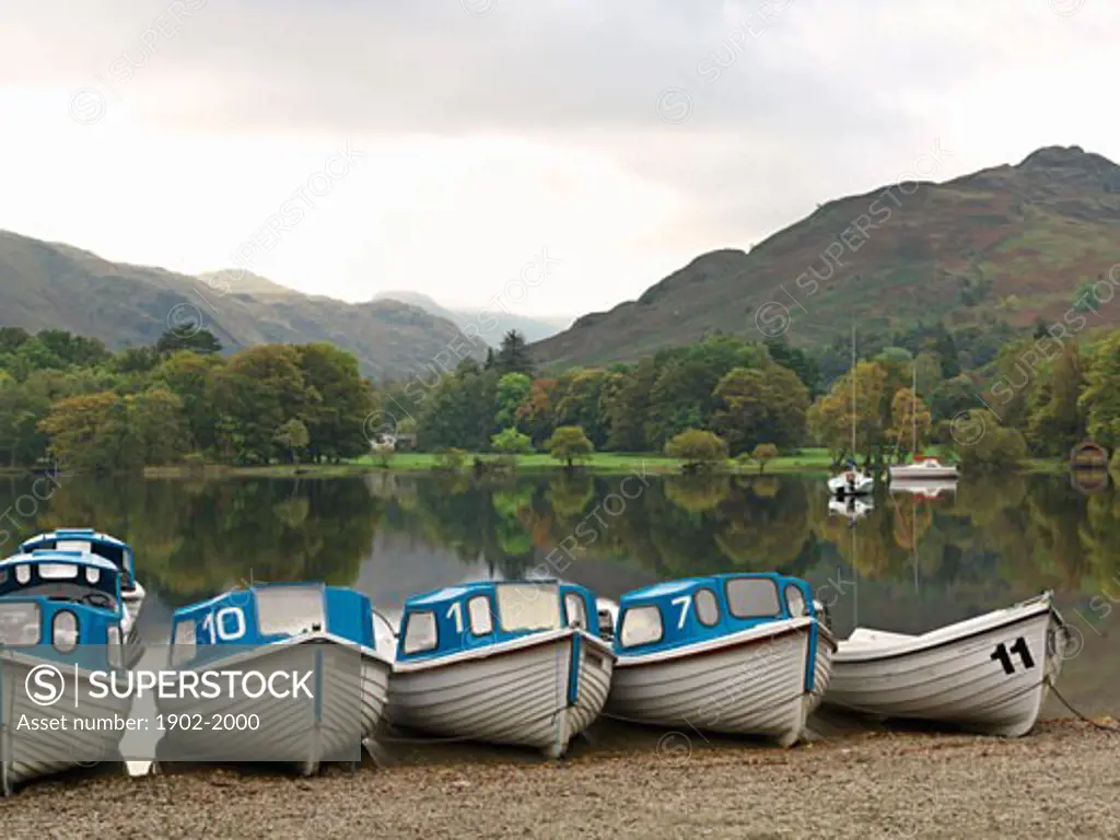 United Kingdom Cumbria Lake District National Park Ullswater Glenridding row of boats for rent at Ullswater
