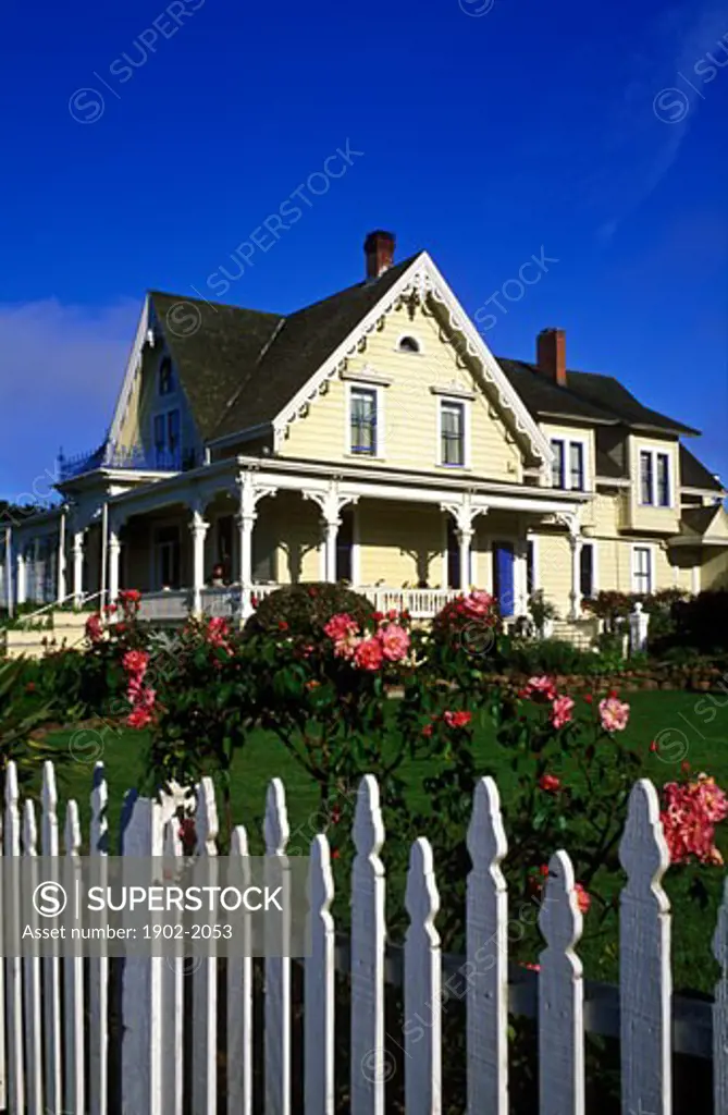 USA California Mendocino Bed and Breakfast house Victorian home with rose garden and white picket fence
