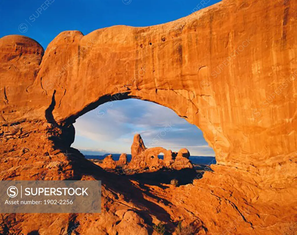 US Utah Arches National Park view of Turret Arch through the North Window at sunrise