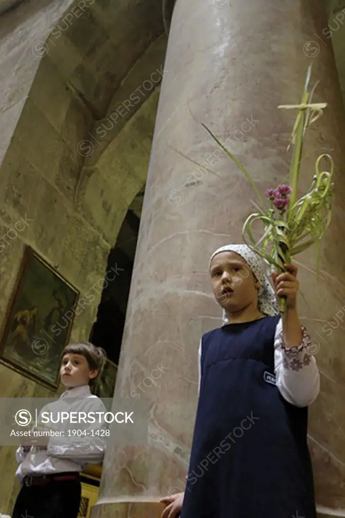 children watching the Palm Sunday ceremony Jerusalem