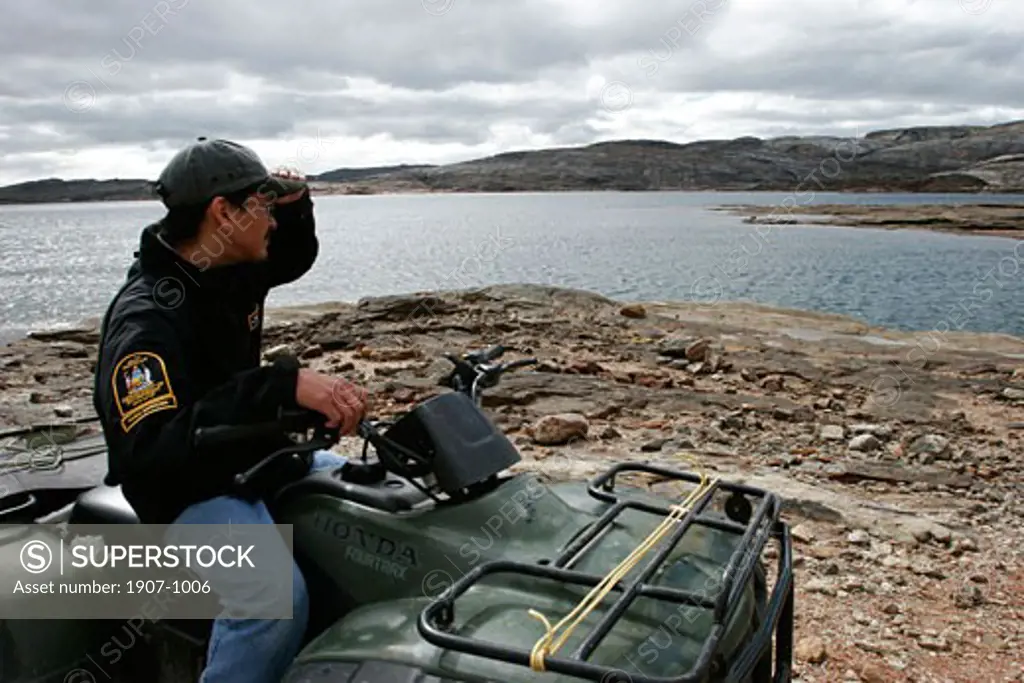 A guard from the National Park is watching around Nunavut coast on Baffin island  near Cape Dorset