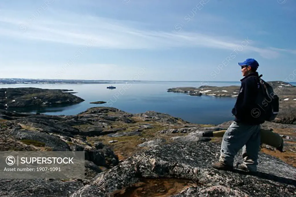 Sightseeing on the Lyubov Orlova in the Killiniq islands  near Baffin island  on frontyard a inuit hunter