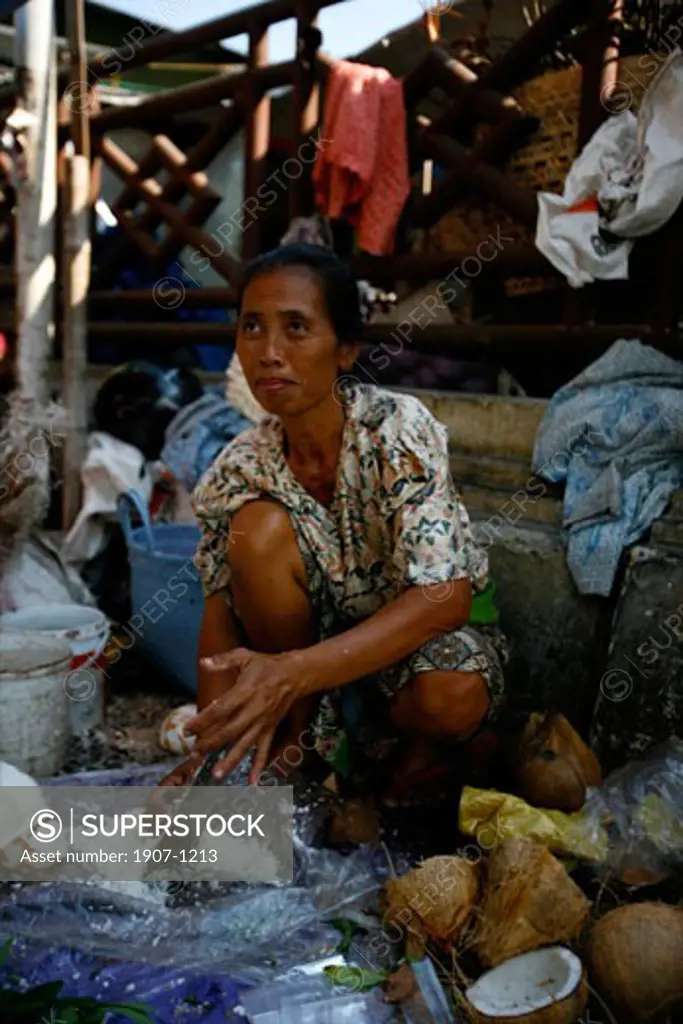Coconut seller at the market of Jogiakarta Java Indonesia