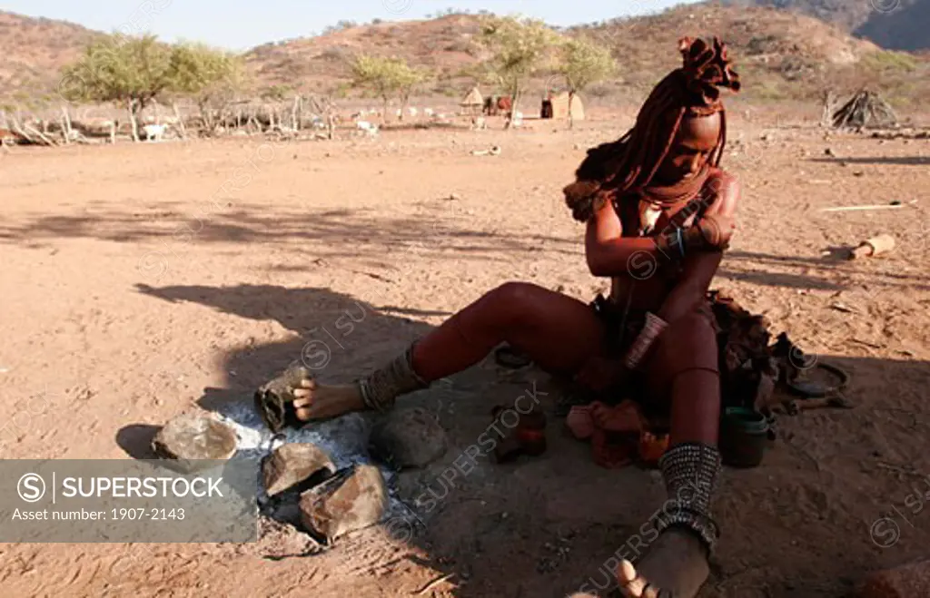 A young himba woman of the Kunene river cover her body with a mix of clay and resin in order to be protected against sun  mosquitos but it is also a ritual of beauty