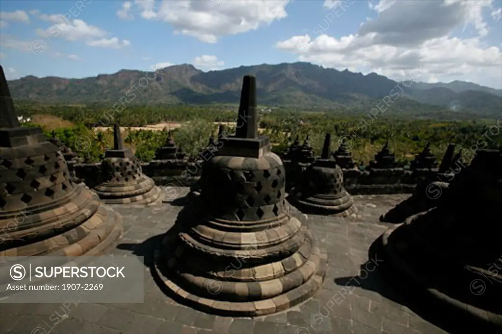 The famous clocks of the roof of Borobudurs temple Java Indonesia