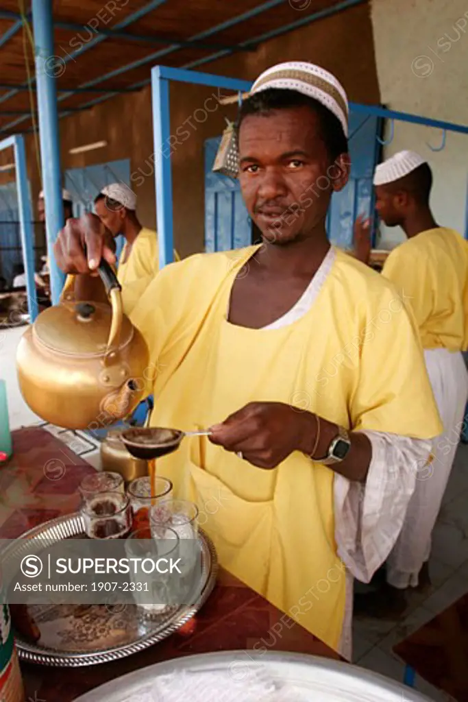 A man is preparing some tea in the village of Kerma  in Nubia