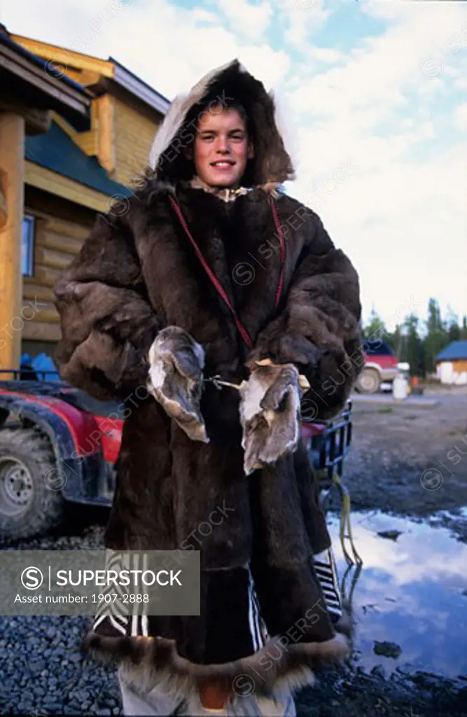 A child with some amerindian traditionnal fur clothes White Horse Yukon