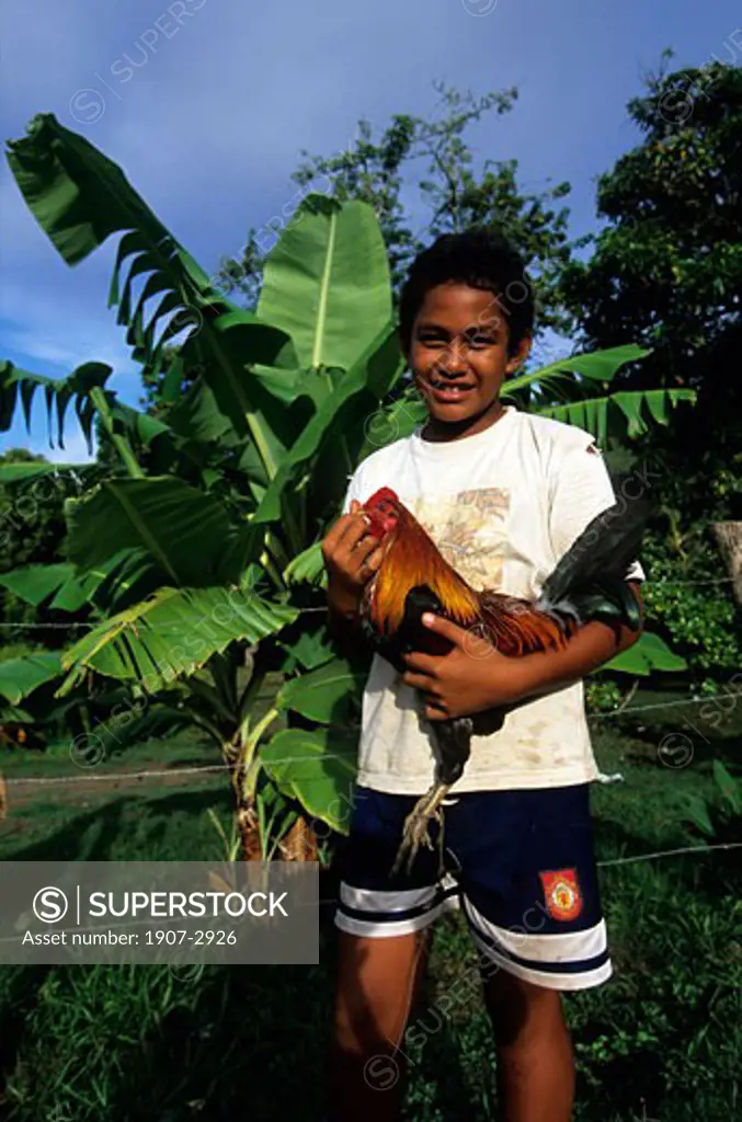 On Ua Po island a young marquisian with his male chicken Marquisian islands