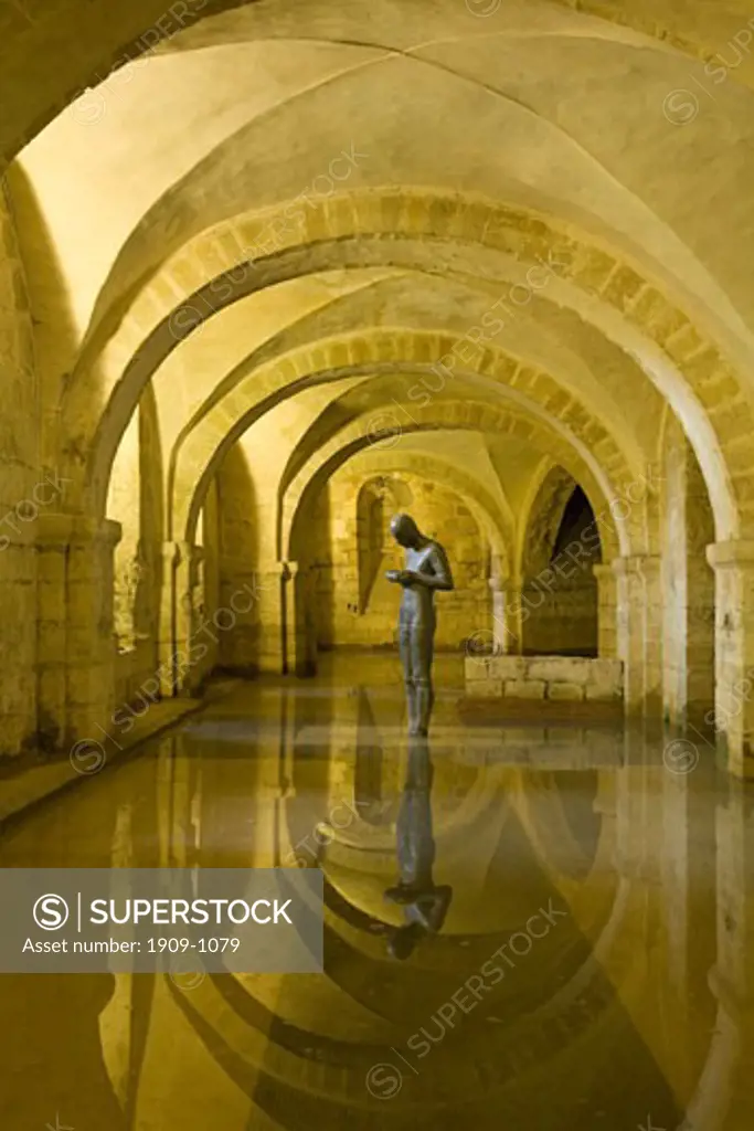 Sound II 2 sculpture statue by artist Anthony Gormley in the flooded crypt of Winchester Cathedral Hampshire England United Kingdom GB Great Britain British Isles Europe EU