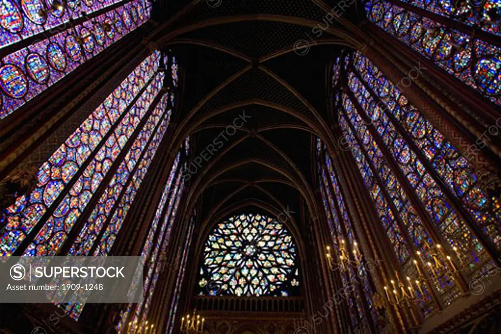 Interior of Sainte-Chapelle showing medieval stained glass window panels Paris France Europe EU
