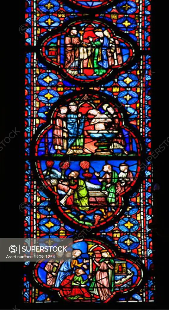 Interior of Sainte-Chapelle showing detail of medieval stained glass window panels Paris France Europe EU