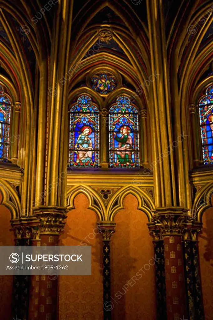 Interior of Lower Chapel in Sainte-Chapelle showing medieval stained glass window panels Paris France Europe EU