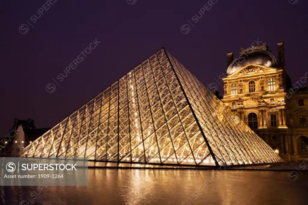 Glass Pyramide at entrance to Le Louvre Museum and Art Gallery at night Paris France Europe EU