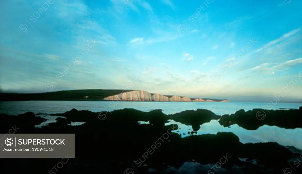 Seven Sisters white chalk cliffs Sussex England United Kingdom UK Great Britain Europe taken at low tide from Cuckmere Haven beach soon after sun set