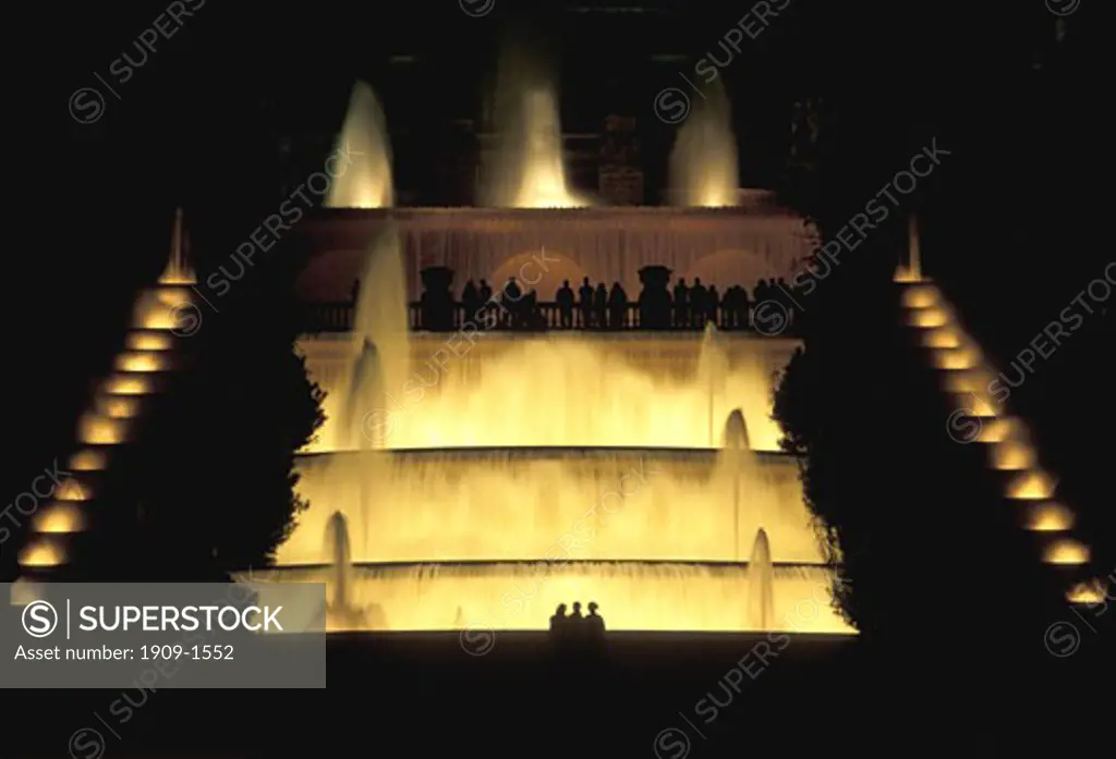 tripod photo of the Font Magica or Magic Fountain at night below the Palau Nacional in Barcelona Catalonia Spain Espana Europe where floodlit fountains and cascades are accompanied by a musical evening performance