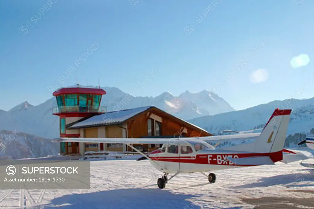 Cessna waits for take off at Courchevel Heliport in mountains of the Trois Vallees Three Valleys ski region of French Alps France Europe