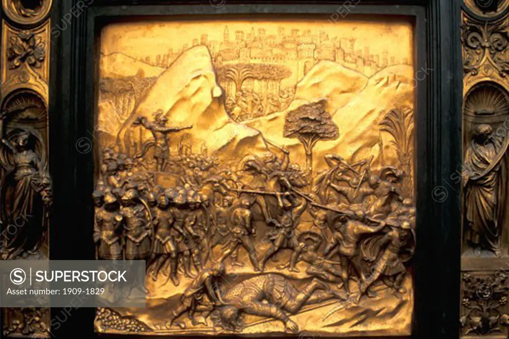 Florence Duomo Baptistry East doors Lorenz Ghiberti Florence Tuscany Italy Italia Europe Lorenzo Ghiberti worked on the east doors from 1424 to 1452 Michelangelo described them as the Gates of Paradise This panel shows the Battle with the Philistines