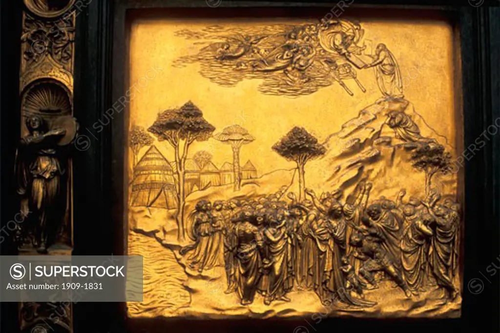 Florence Duomo Baptistry East doors Lorenz Ghiberti Florence Tuscany Italy Italia Europe Lorenzo Ghiberti worked on the east doors from 1424 1452 Michelangelo called them the Gates of Paradise This panel shows Moses receiving the Ten Commandments