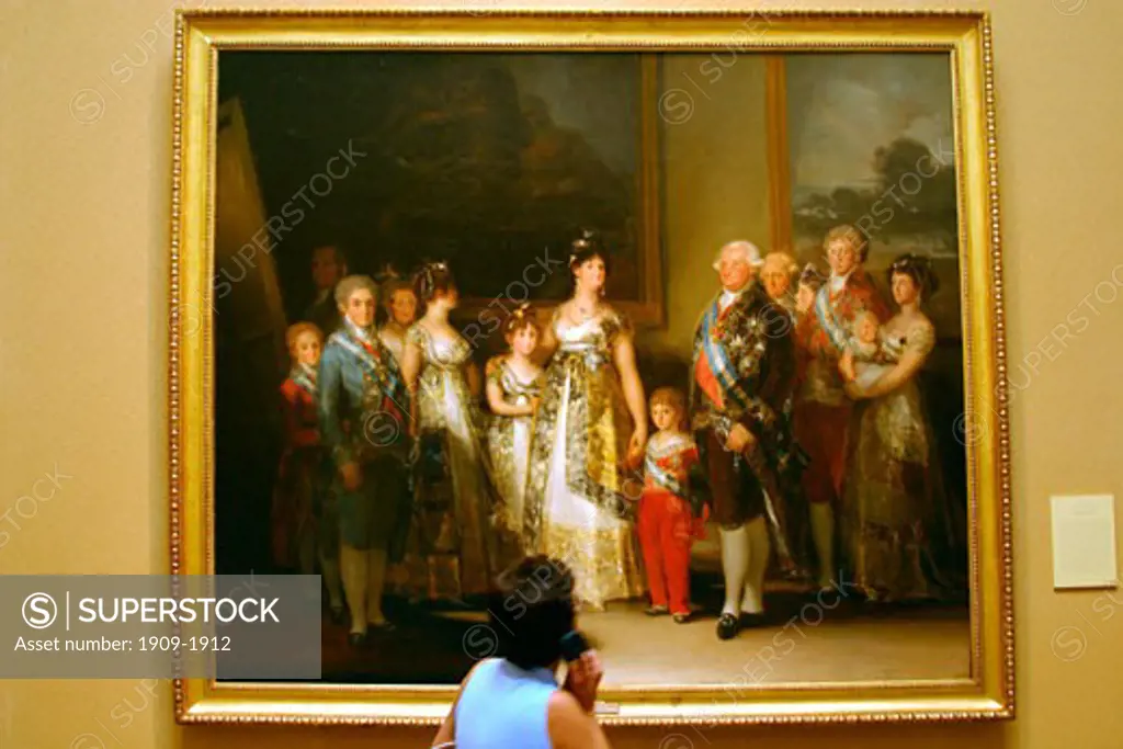 Madrid Museo del Prado Museum and Art Gallery tourist admires Charles IV and family by Goya Madrid Spain Espana Europe EU painted in 1800 oil on canvas Goya y Lucientes Francisco Jose de 1746 1828