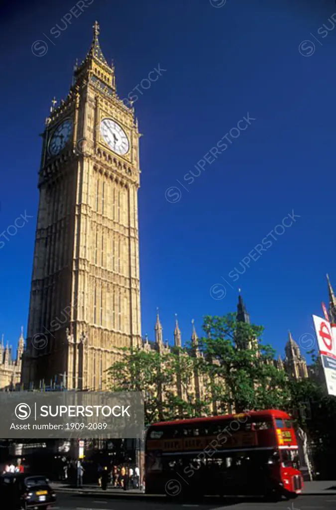 London Big Ben and the Houses of Parliament with tourists on an open top red bus on a summers evening in Westminster England United Kingdom Great Britain GB UK Europe