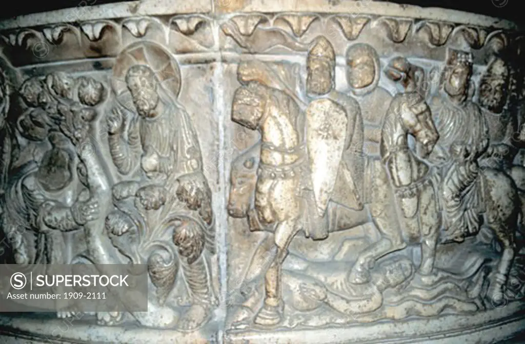 Lucca San Frediano Church romanesque carved font showing the Life of Moses 13th Century Lucca Tuscany Italy Europe EU This carving shows Moses and followers dressed in 12th century armour passing through the Red Sea with camels