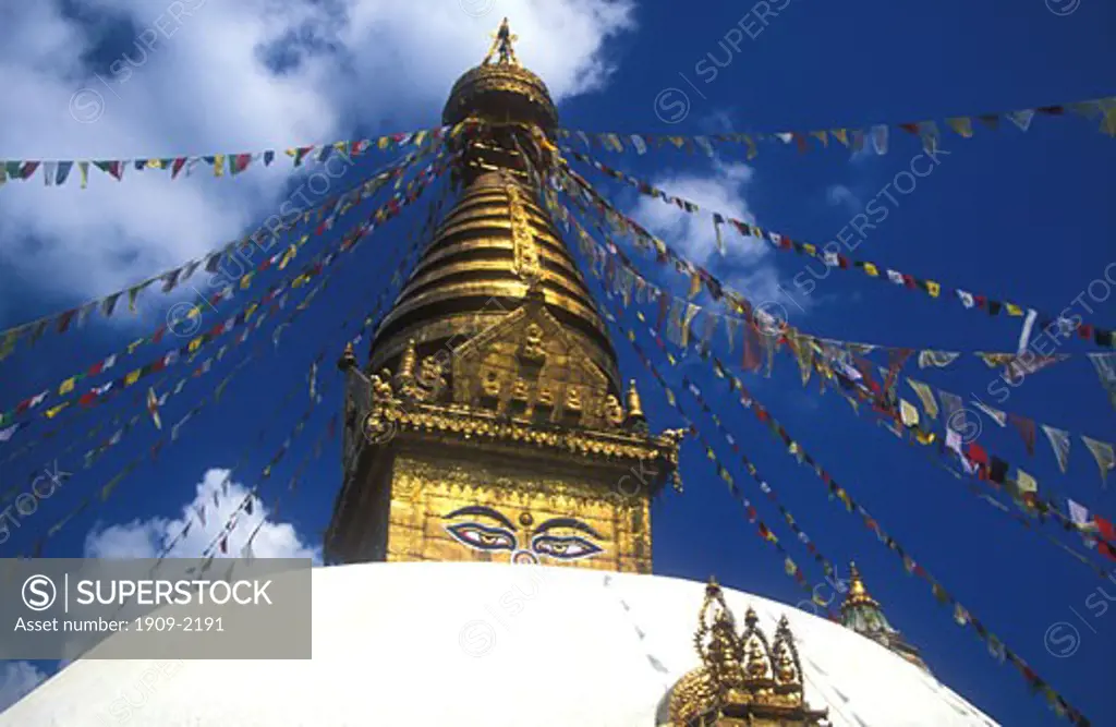 The All Seeing eyes of Swayamhunath Buddhist Stupa known also as the Monkey Temple gaze down on the valley of Kathmandu in Nepal Asia This is a popular tourist destination but also a place of worship and pilgrimage