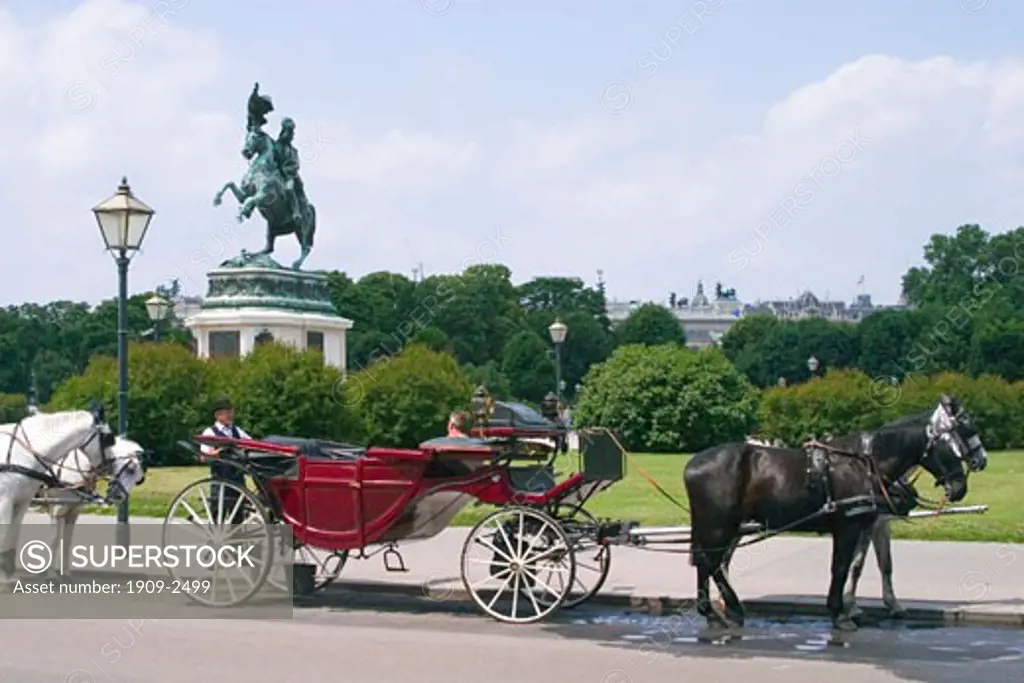 Horse drawn carriage at Fiaker Helden Platz in spring sun sunshine Vienna Austria Europe