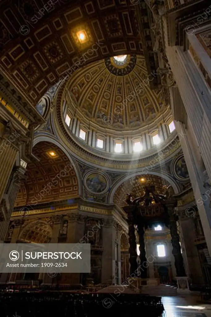 St Peters Peters Basilica interior with dome and bronze canopy by Bernini over the papal high altar The Vatican Rome Italy