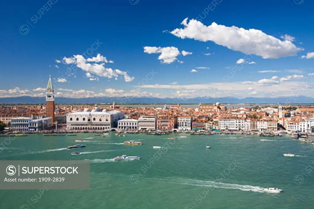 Venice waterfront panorama on sunny summers day with Doges Palace and Campanile with blue sky and white clouds taken from belltower of San Giorgio Maggiore Veneto Italy Europe EU