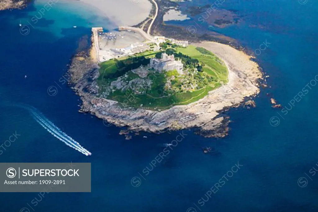 St Michaels Michaels Mount from the air with speed boat in the sea aerial view Cornwall England UK United Kingdom Great Britain GB British Isles Europe EU
