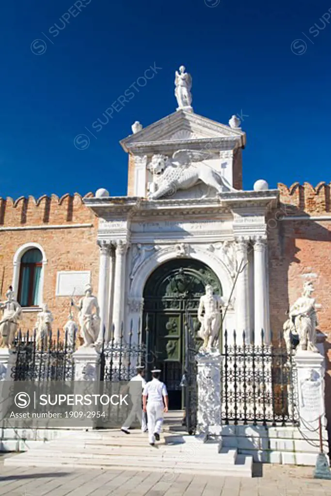 Sailors from the Italian Navy enter the Arsenale main entrance to naval dockyard Castello district Venice Veneto Italy Europe EU At the height of Venices power the Arsenale was the largest shipbuilding area in the known world