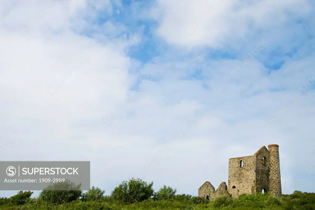 Wheal Reath ruined cornish tin mine engine house in summer sunshine with blue sky and white clouds Cripplesease St Ives West Penwith Cornwall England UK United Kingdom GB Great Britain British Isles Europe EU