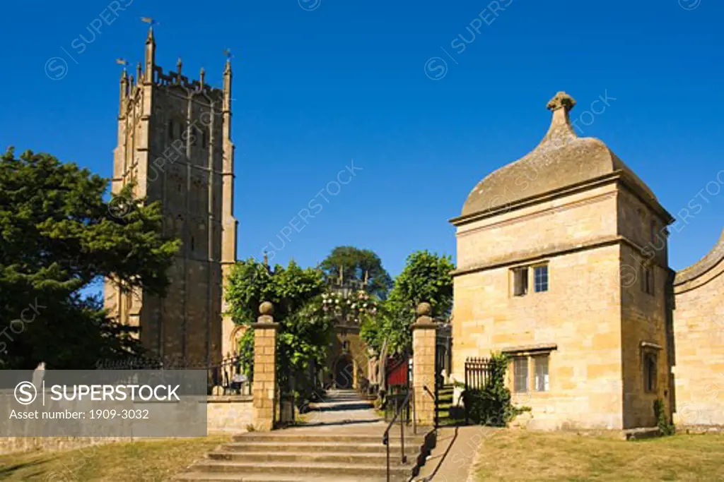 Chipping Campden english traditional church and gateway lodge in village in summer sunshine Cotswolds Gloucestershire UK United Kingdom GB Great Britain British Isles Europe EU